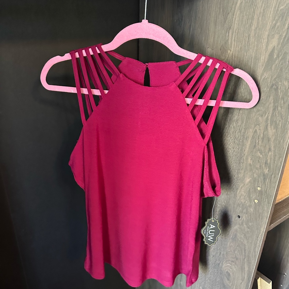 Small maroon red shirt. Fits like a medium.